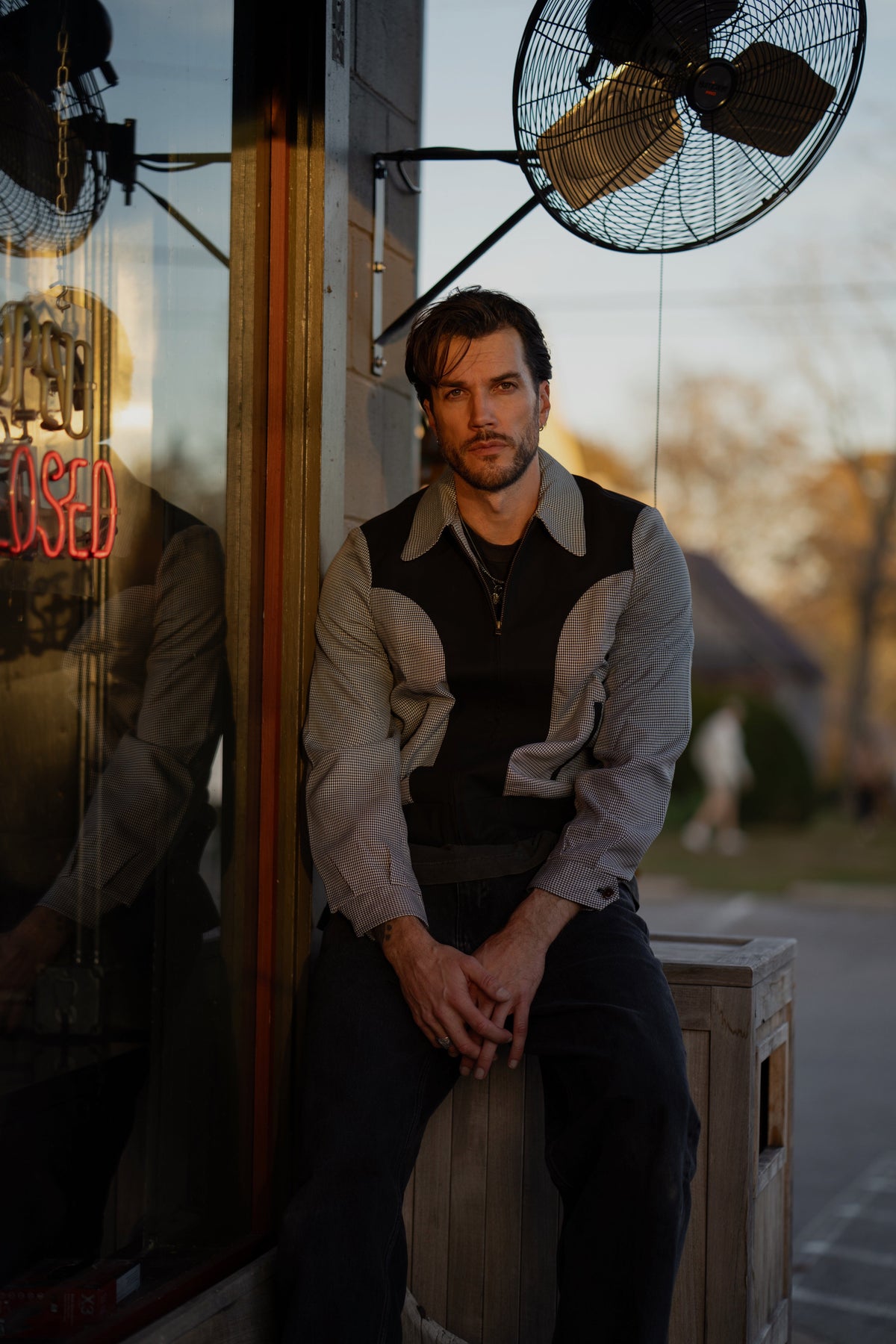 H Bar C Kentucky jacket in black houndstooth with black suede western yoke, zip front, and ribbed waistband, worn by a model