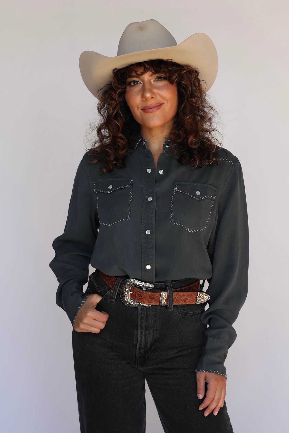 Woman in charcoal shirt