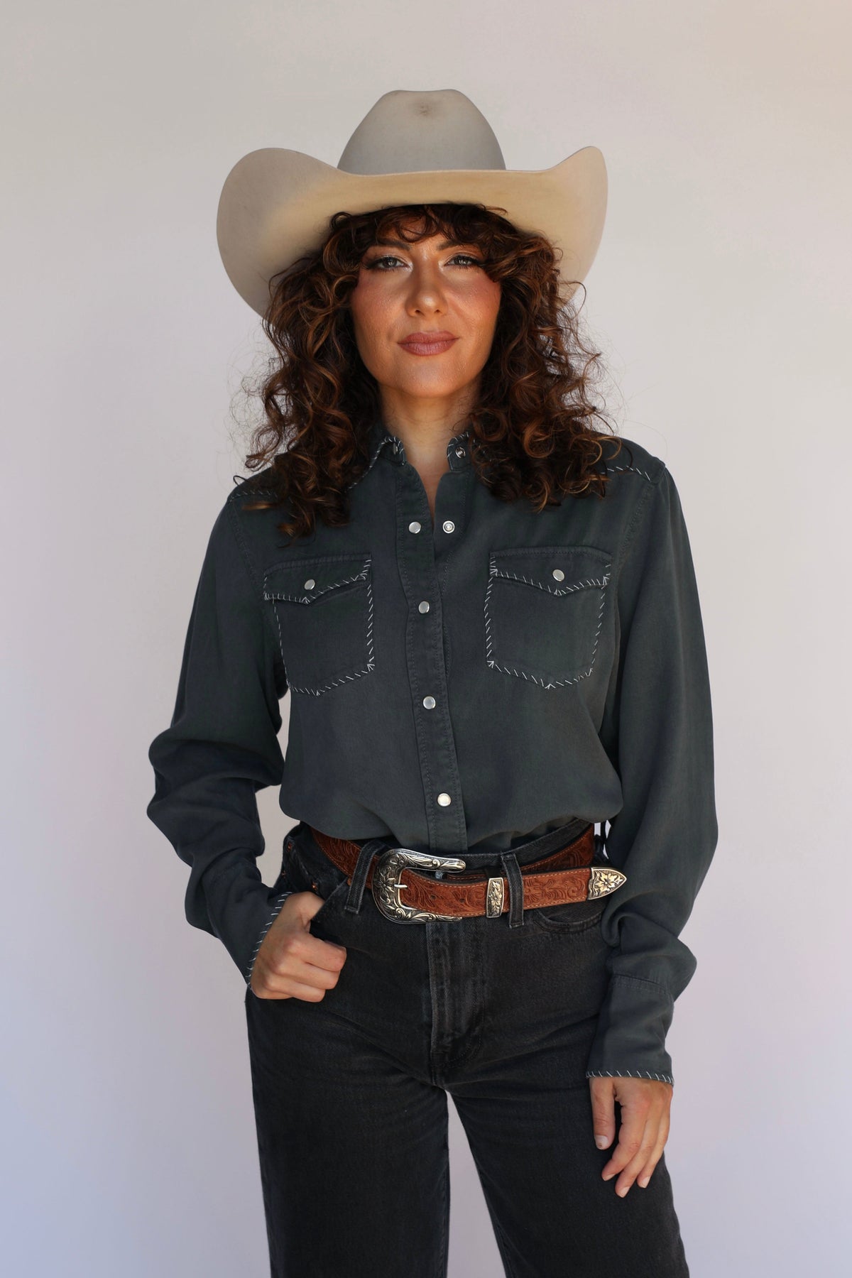 Woman in charcoal shirt