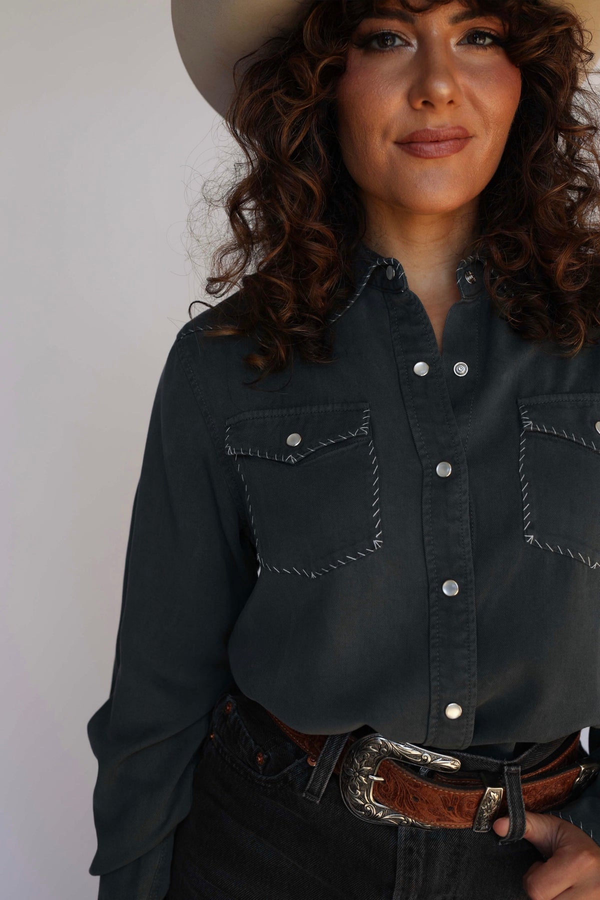 Woman in charcoal shirt