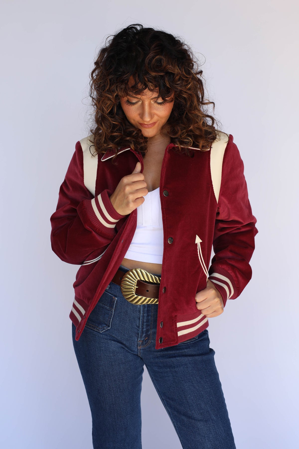 Front view of the H Bar C Silver Lake maroon corduroy western jacket on a woman, with striped ribbed trim and arrow pockets.