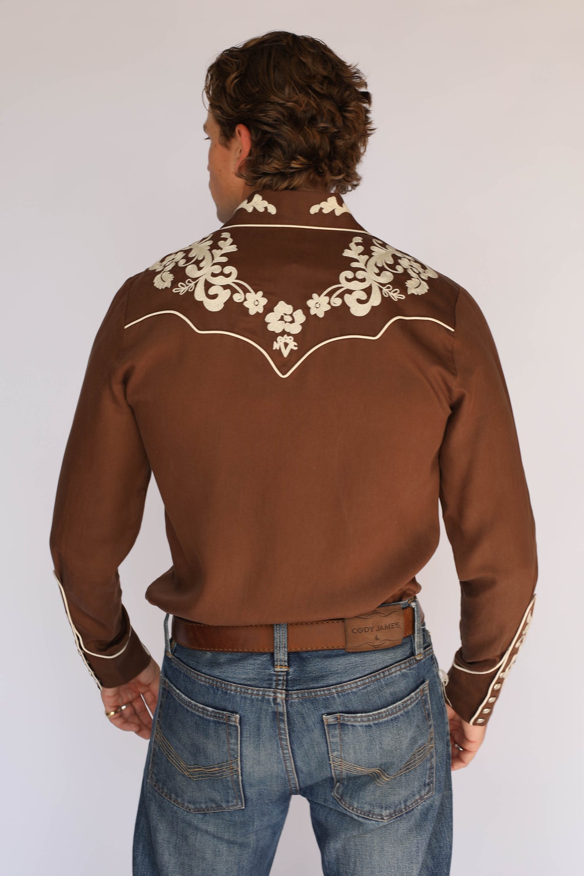 Back view of the H Bar C Durango brown western shirt, vintage inspired western wear with cream chain stitch embroidery across the back yoke.