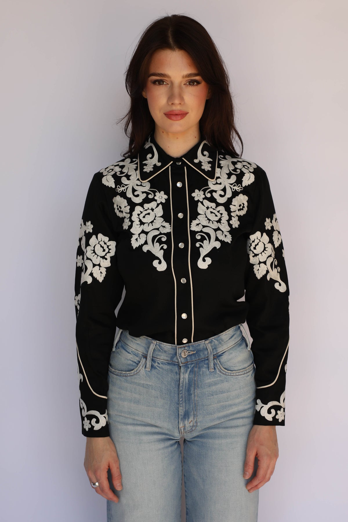 Model in the H Bar C Fort Worth black western shirt with ornate ivory chain stitch florals, classic vintage western wear.