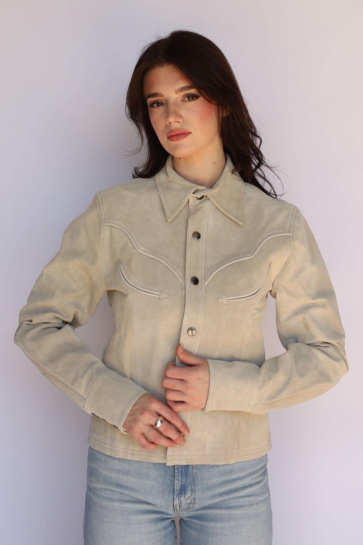 H Bar C Austin stone jacket on a woman with hands at the hem, vintage inspired western wear.