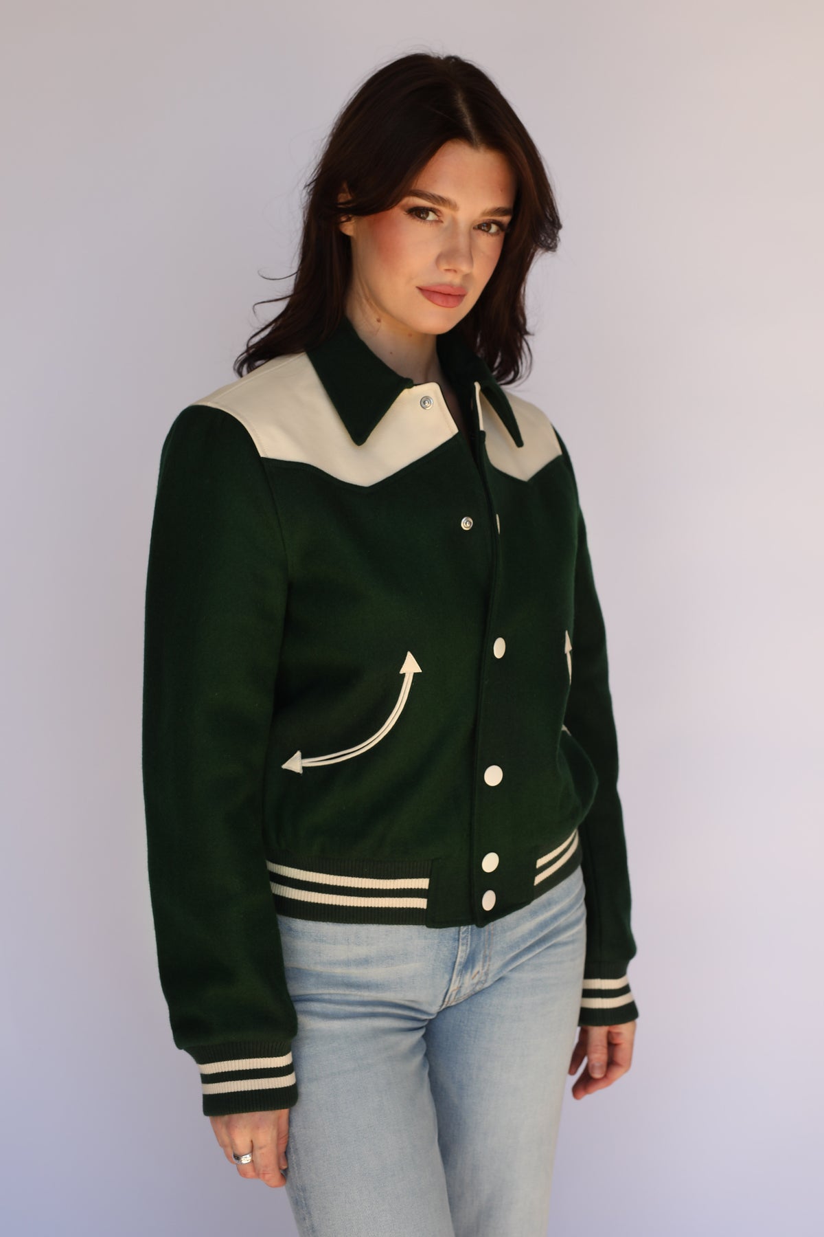 Woman wearing the Vail Unisex Jacket in green