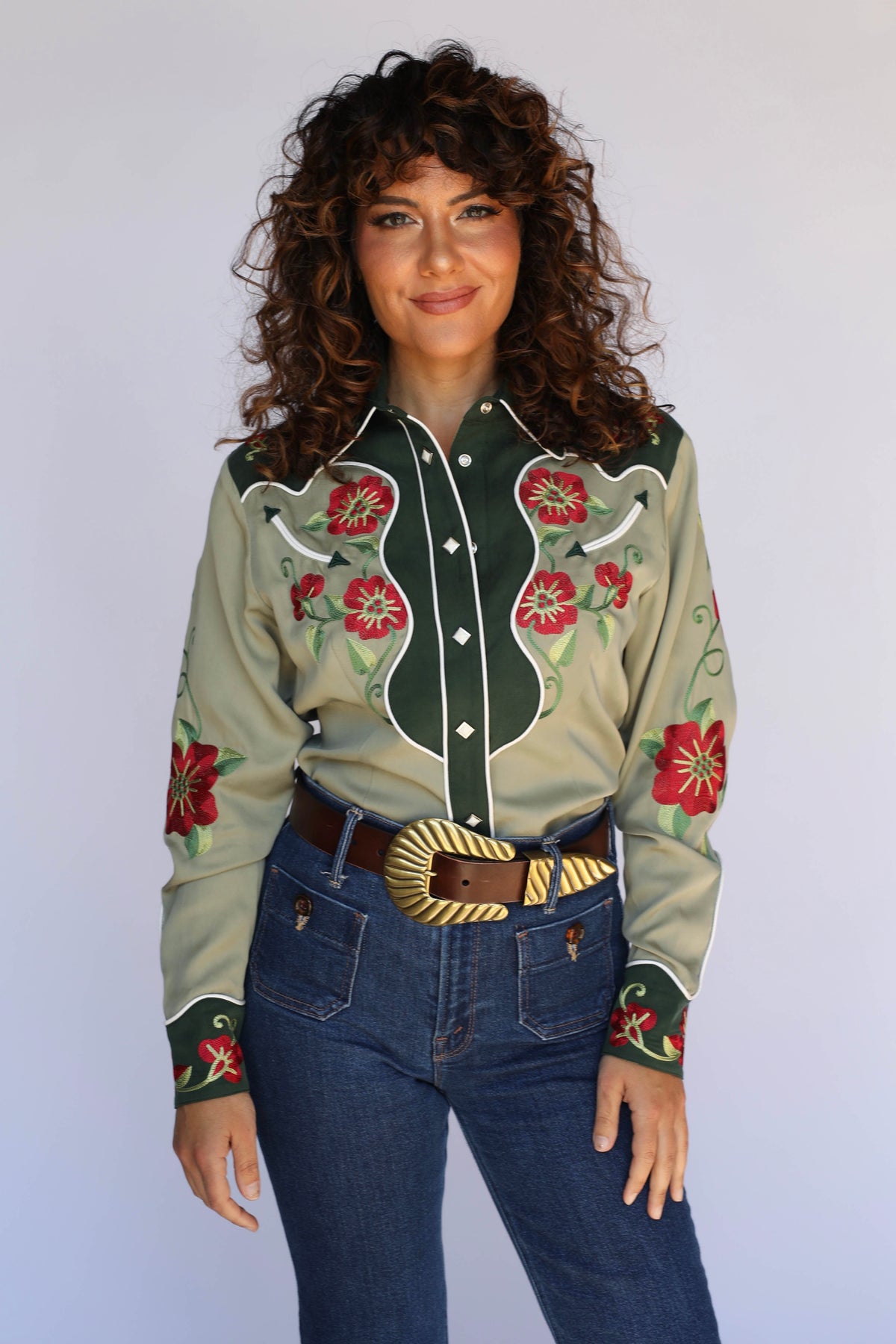 H Bar C Santa Ana green women's western shirt with red poppy embroidery on the yokes and sleeves, diamond snaps, and embroidered cuffs, worn with high-waist jeans.