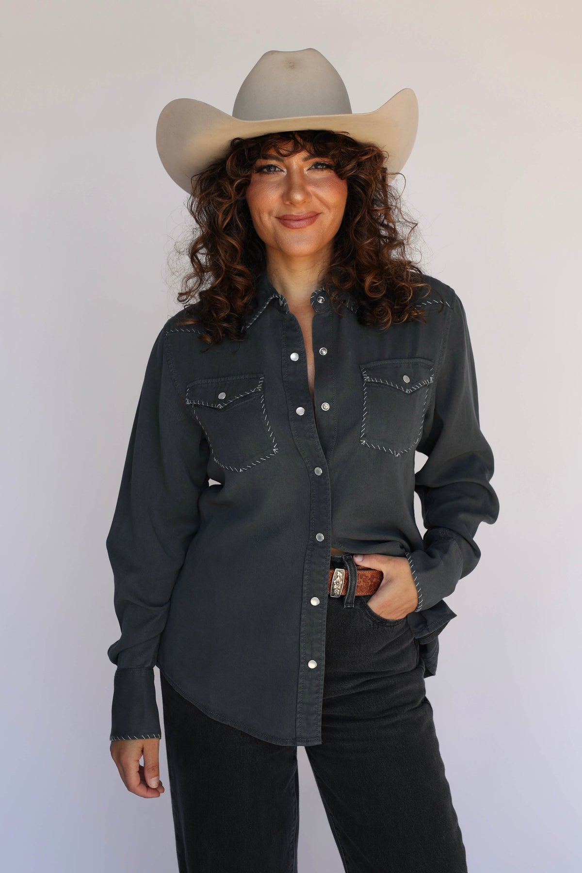 Woman in charcoal shirt