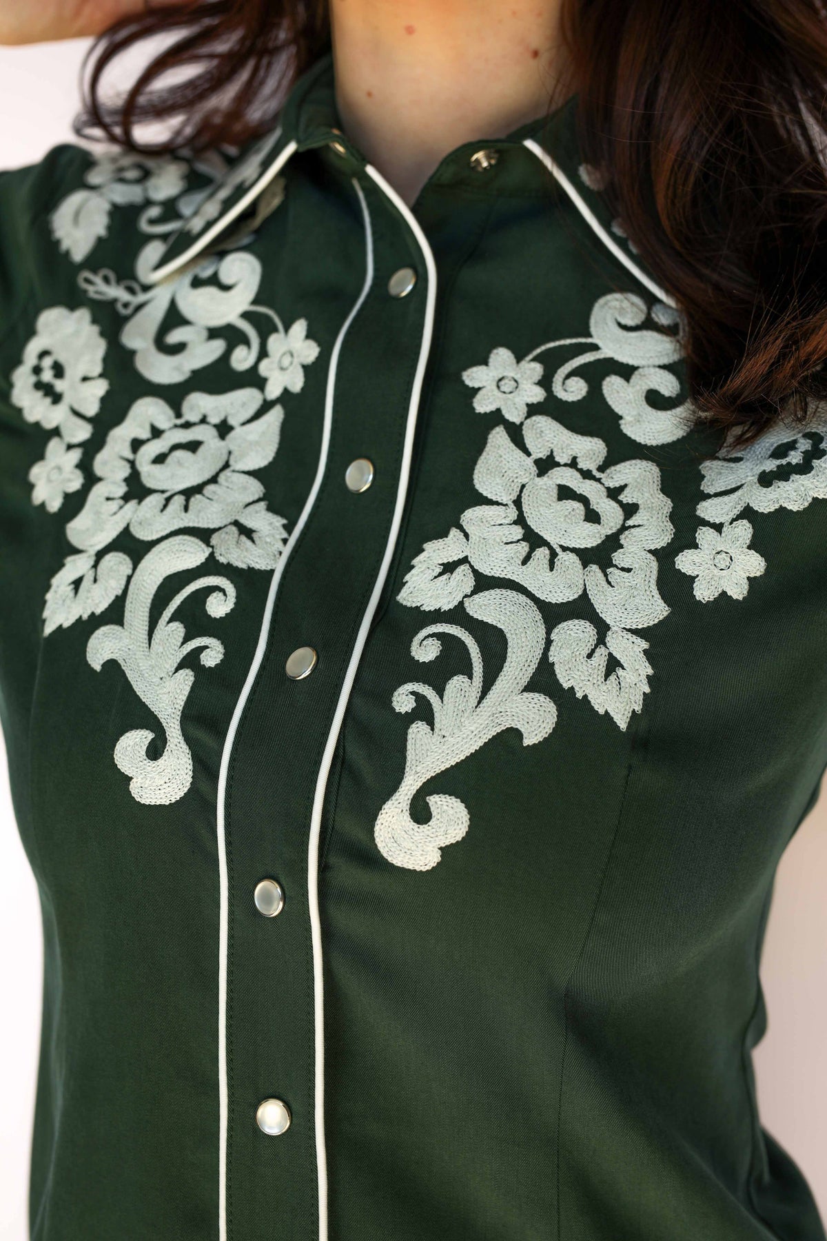 Womens green shirt up close