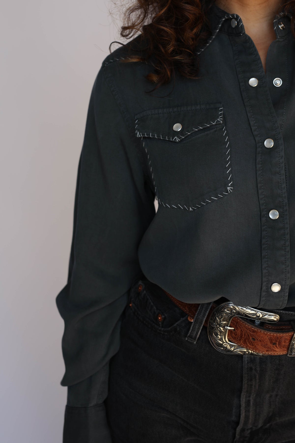 Woman in charcoal shirt