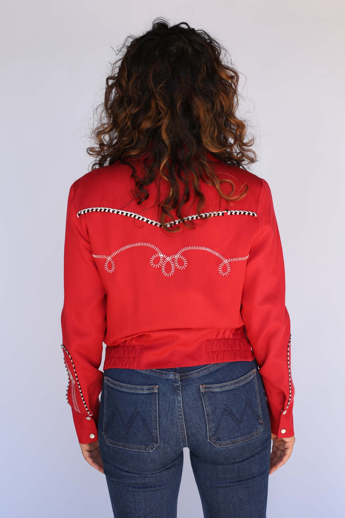Back view of the H Bar C Bolero red cropped western jacket on a female model.
