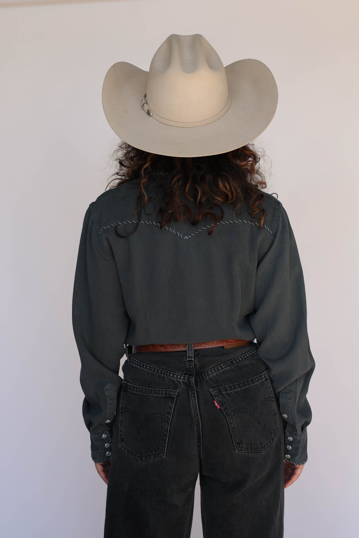 Woman in charcoal shirt
