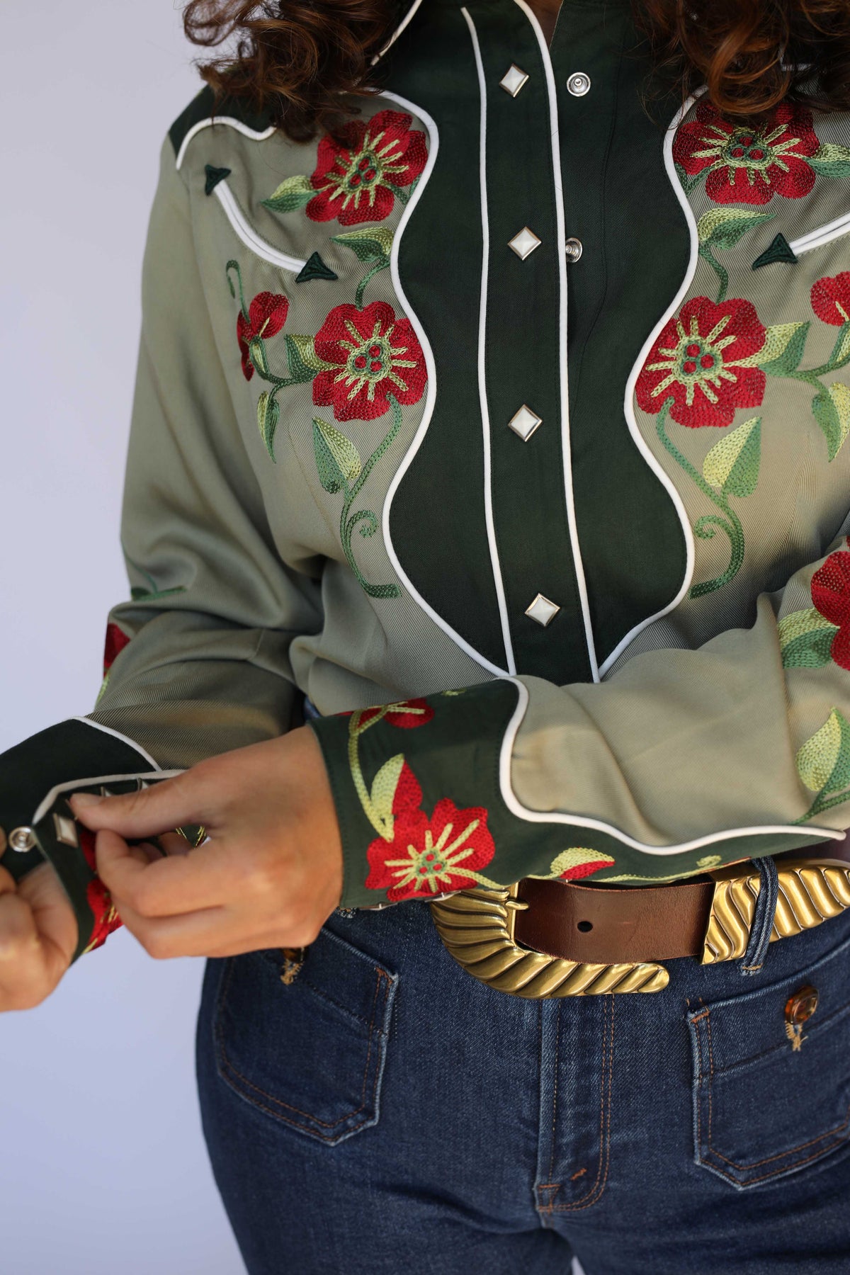 Detail of the embroidered forest green cuff and sleeve florals on the H Bar C Santa Ana women's green western shirt.