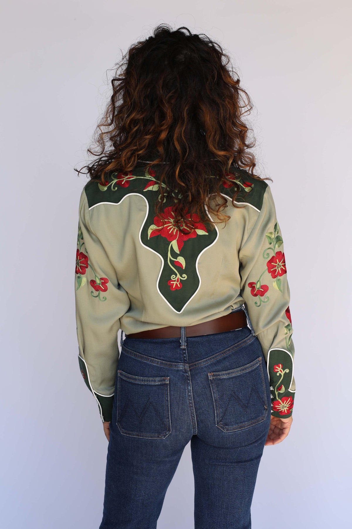 Back view of the H Bar C Santa Ana women's green western shirt with contrast forest green back yoke and red floral embroidery.