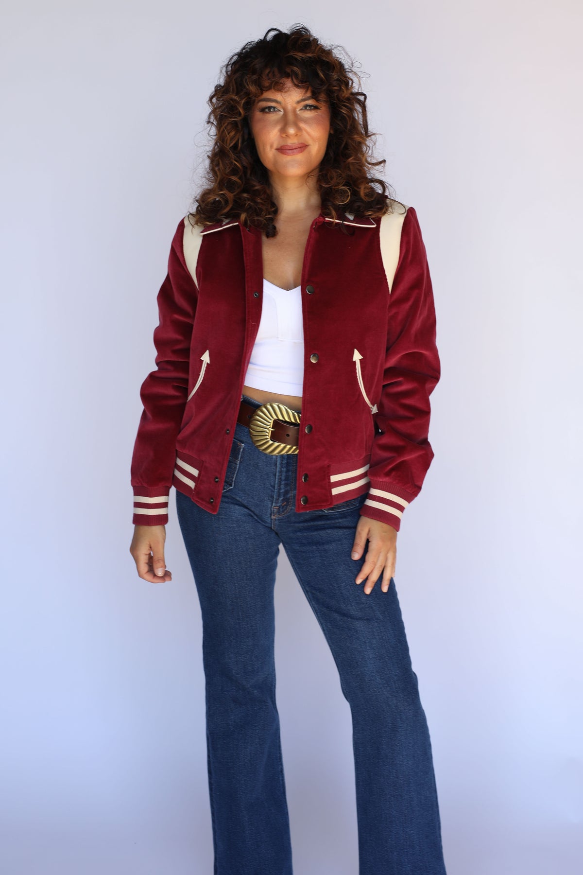 Woman wearing the H Bar C Silver Lake unisex corduroy jacket in maroon with cream lambskin shoulder panels, styled as women's vintage inspired western wear.