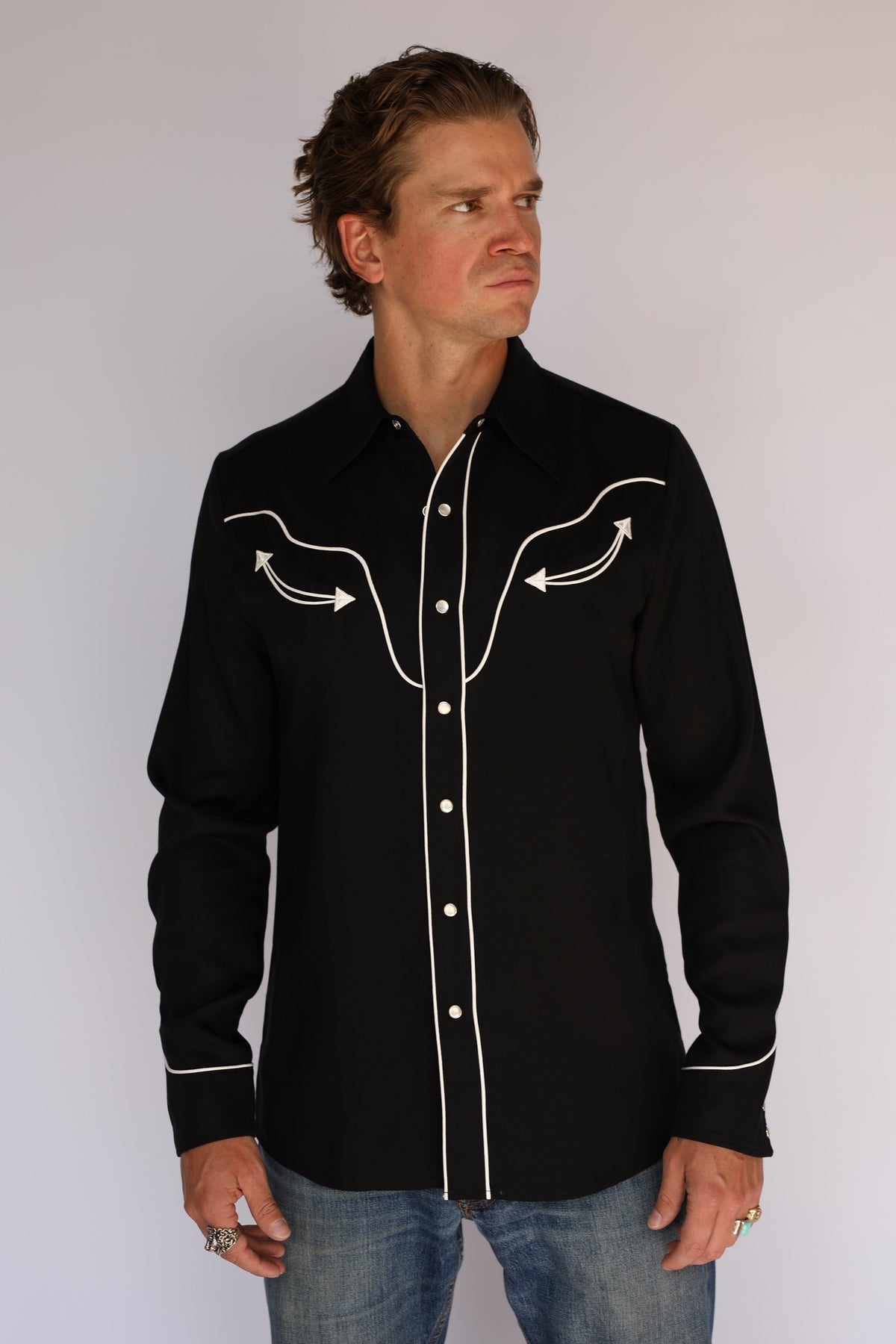 Front view of the H Bar C San Fernando black Tencel shirt with white piped yokes, placket, and cuffs, white arrow embroidery, and pearl snaps, vintage inspired western wear.