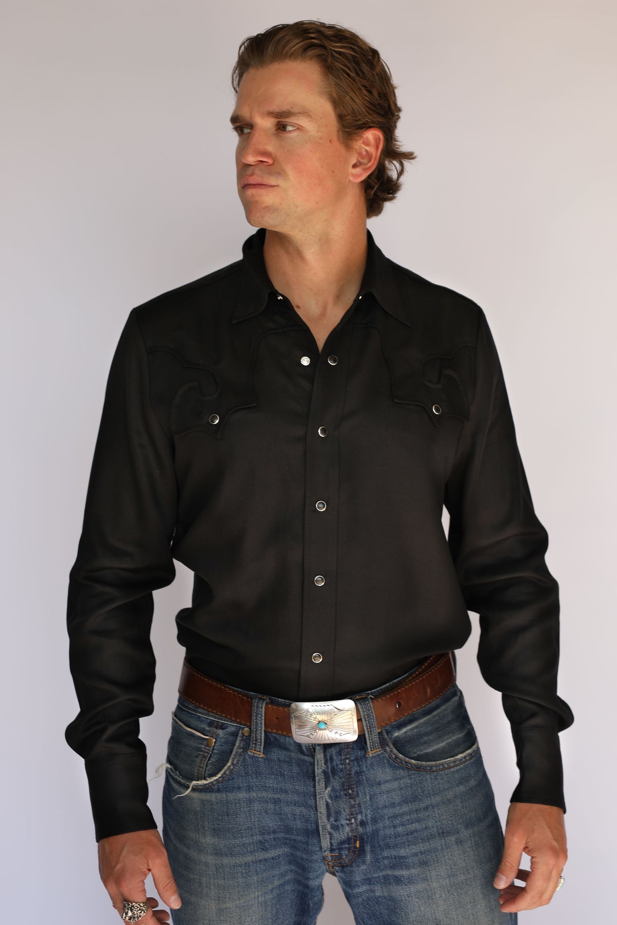 Full front view of the H Bar C El Segundo black western shirt tucked into jeans, showing both archive scroll pockets.