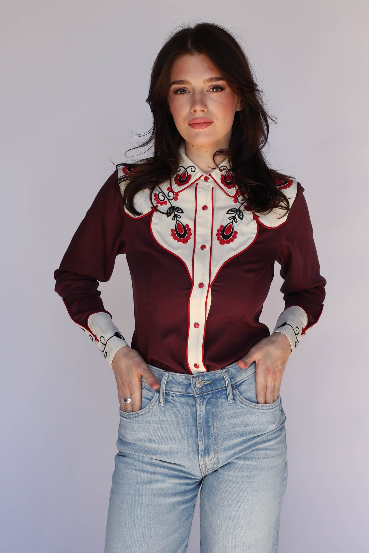 H Bar C San Jose women's burgundy shirt with contrast cream yoke and red and black floral embroidery, vintage inspired western wear worn with light jeans.