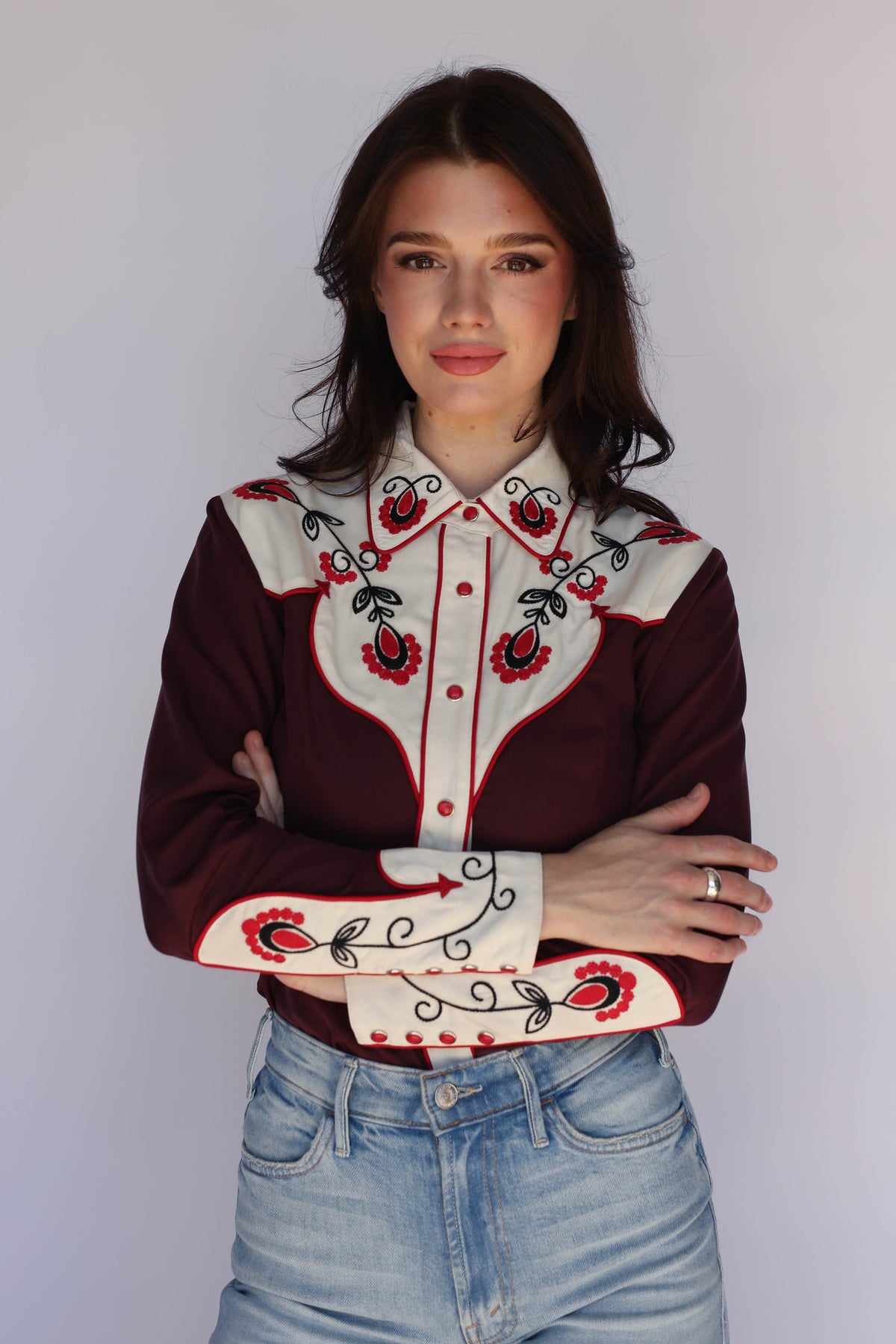 Model in the H Bar C San Jose women's burgundy western shirt with embroidered cream cuffs, vintage inspired western wear.