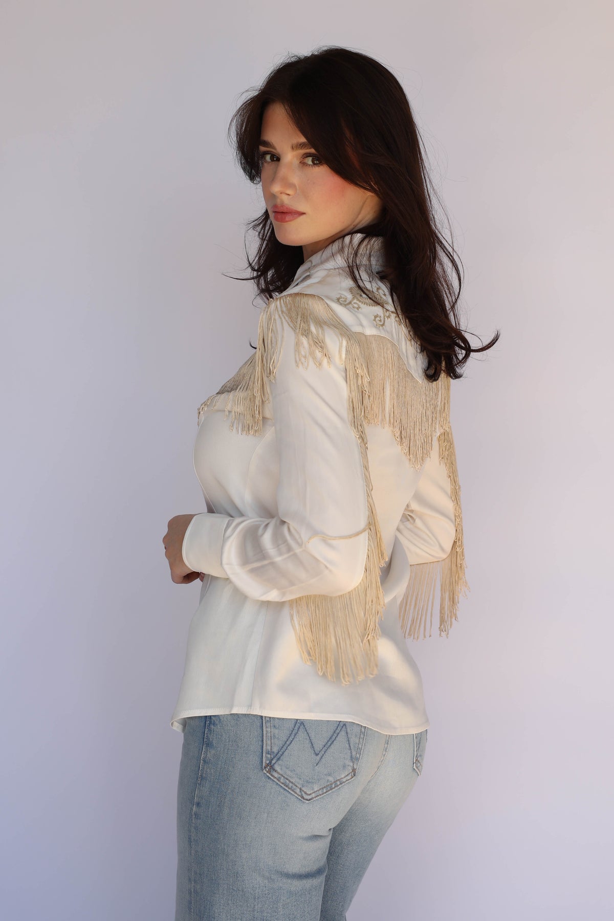 Three-quarter view of the H Bar C Taos white fringe shirt for women, vintage inspired western wear.