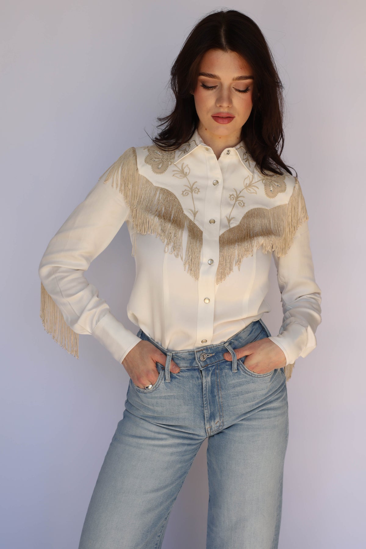 Front view of the H Bar C Taos white fringe western shirt on a woman, vintage western wear.