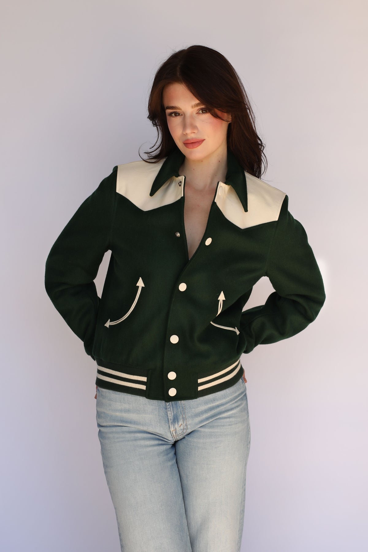 Woman wearing the Vail Unisex Jacket in green