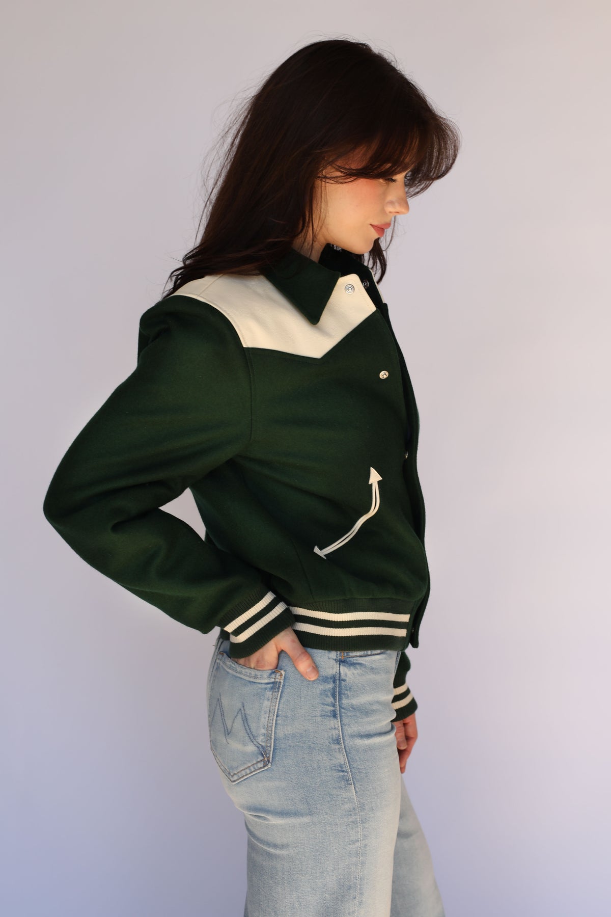 Woman wearing the Vail Unisex Jacket in green