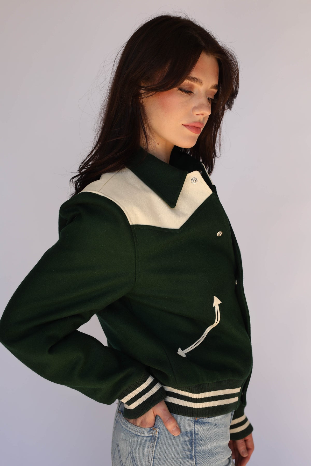 Woman wearing the Vail Unisex Jacket in green