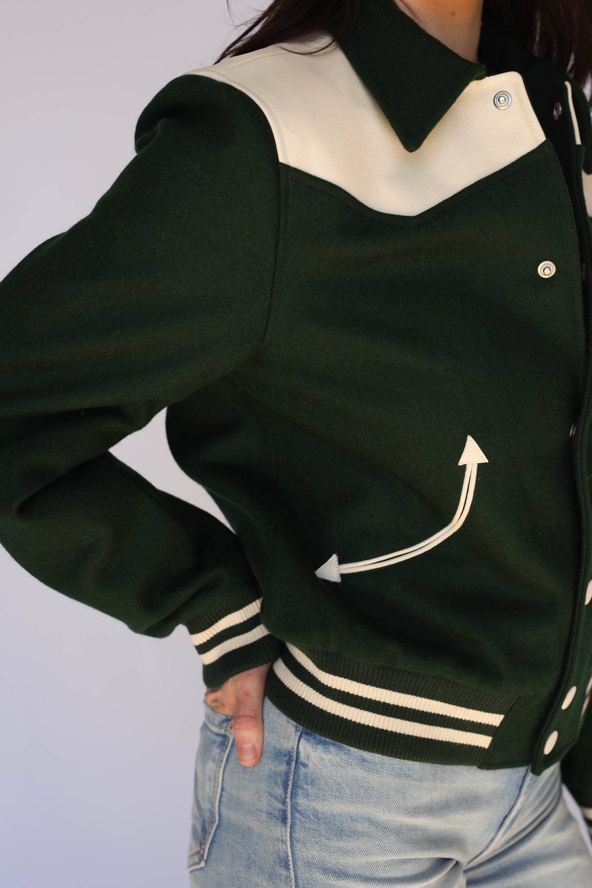 Woman wearing the Vail Unisex Jacket in green