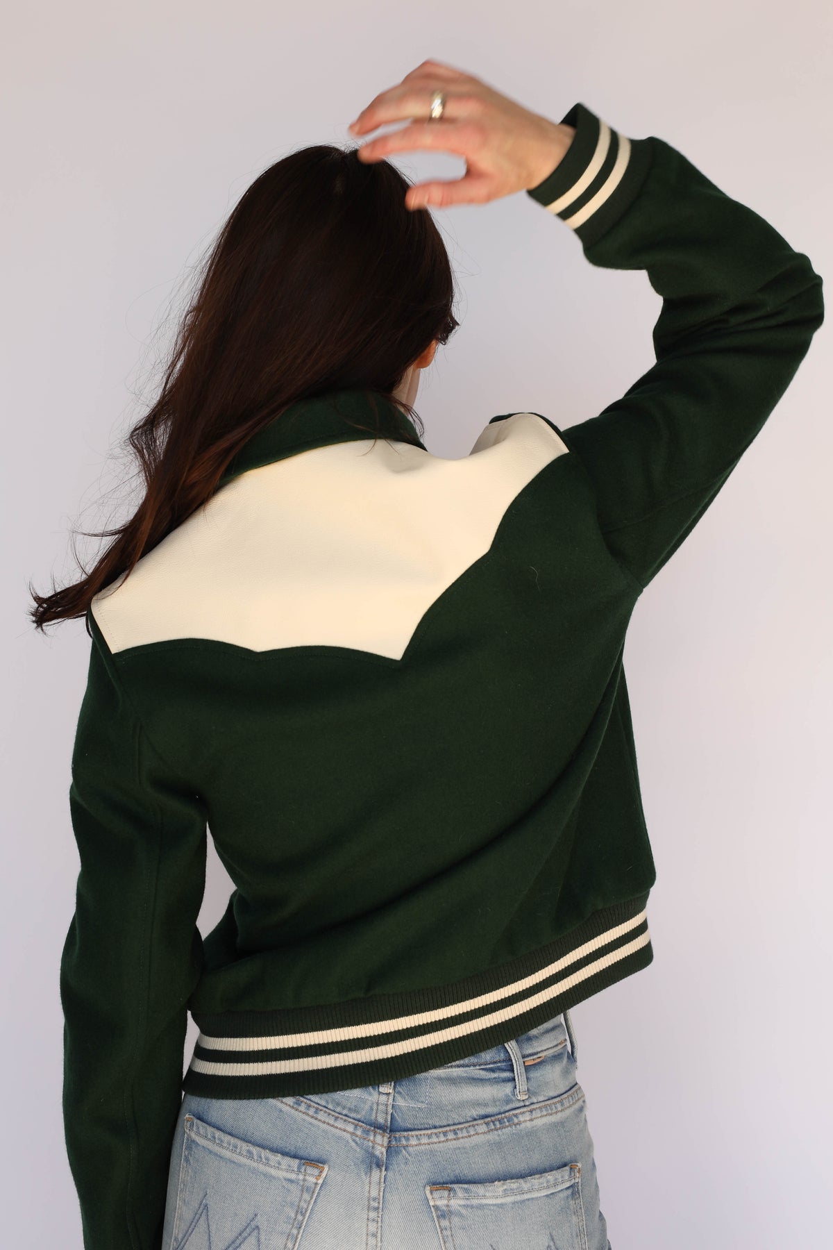 Woman wearing the Vail Unisex Jacket in green